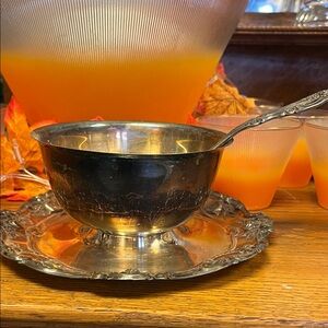 Antique silver gravy boat and ladle